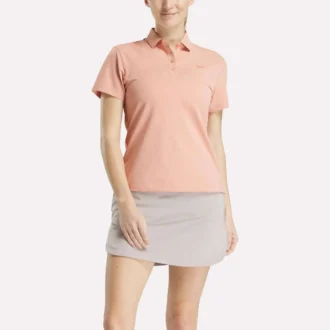 Kortærmet stretch-piké-poloskjorte med knaplukning til kvinder